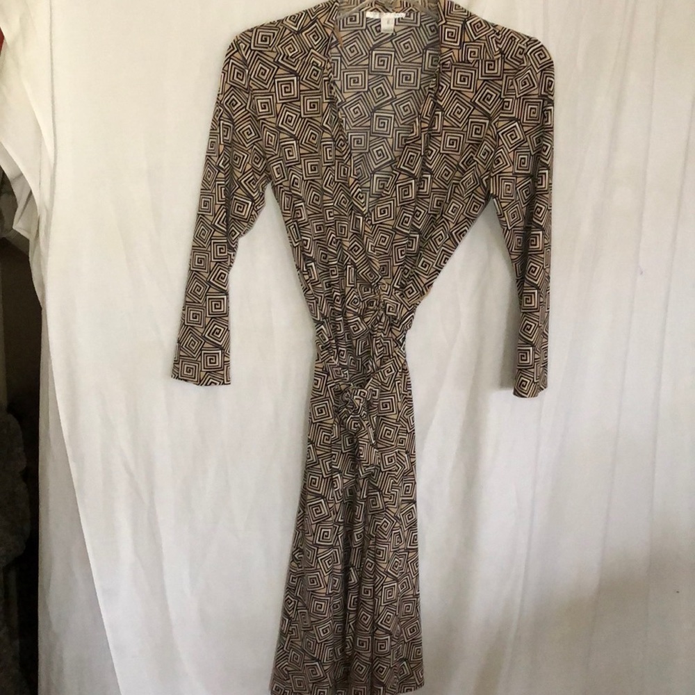 Tan wrap dress with geometric patterns